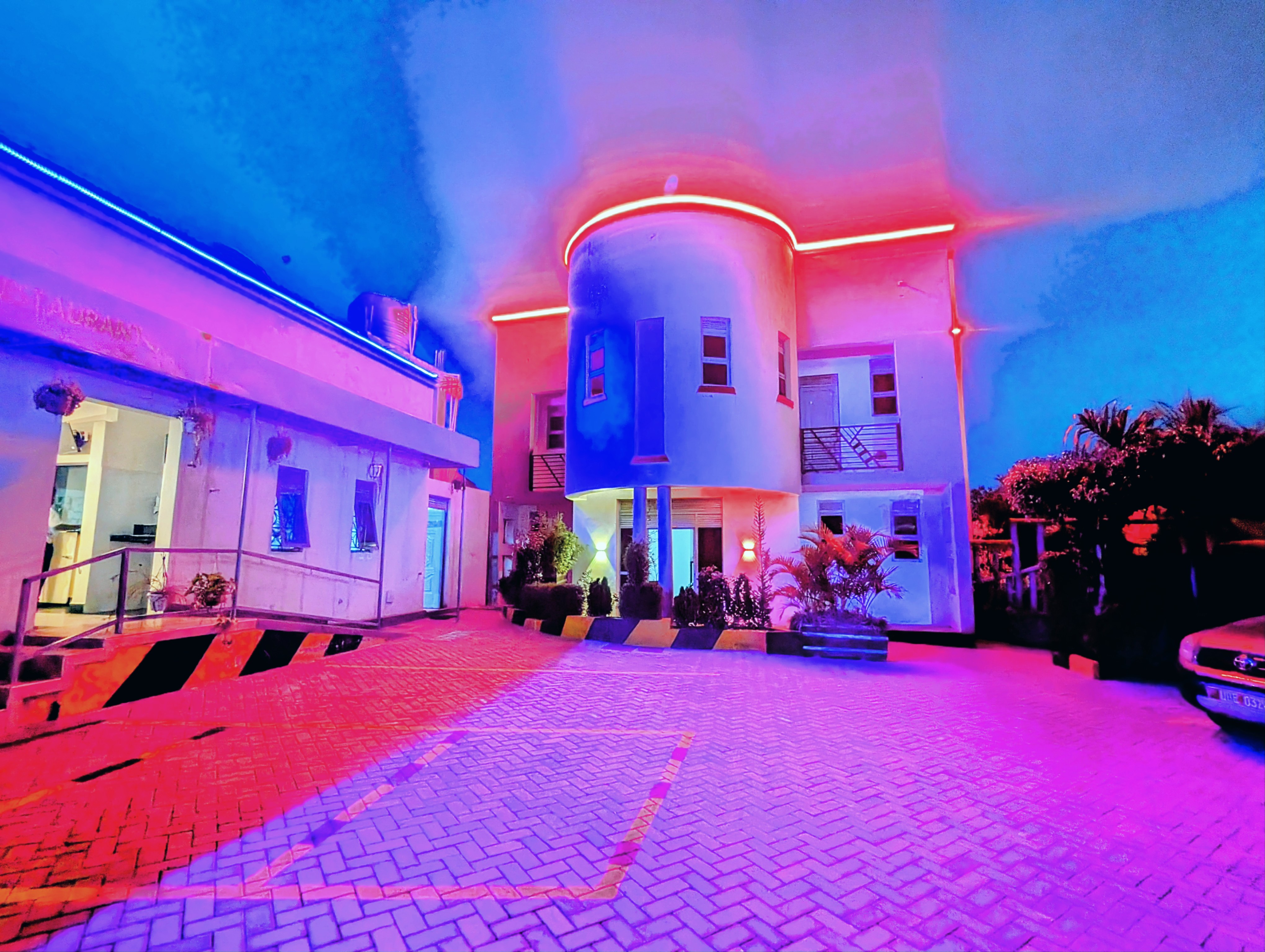 Akengyeya Country Hotel front entrance at night with ambient lighting, Mbarara Uganda