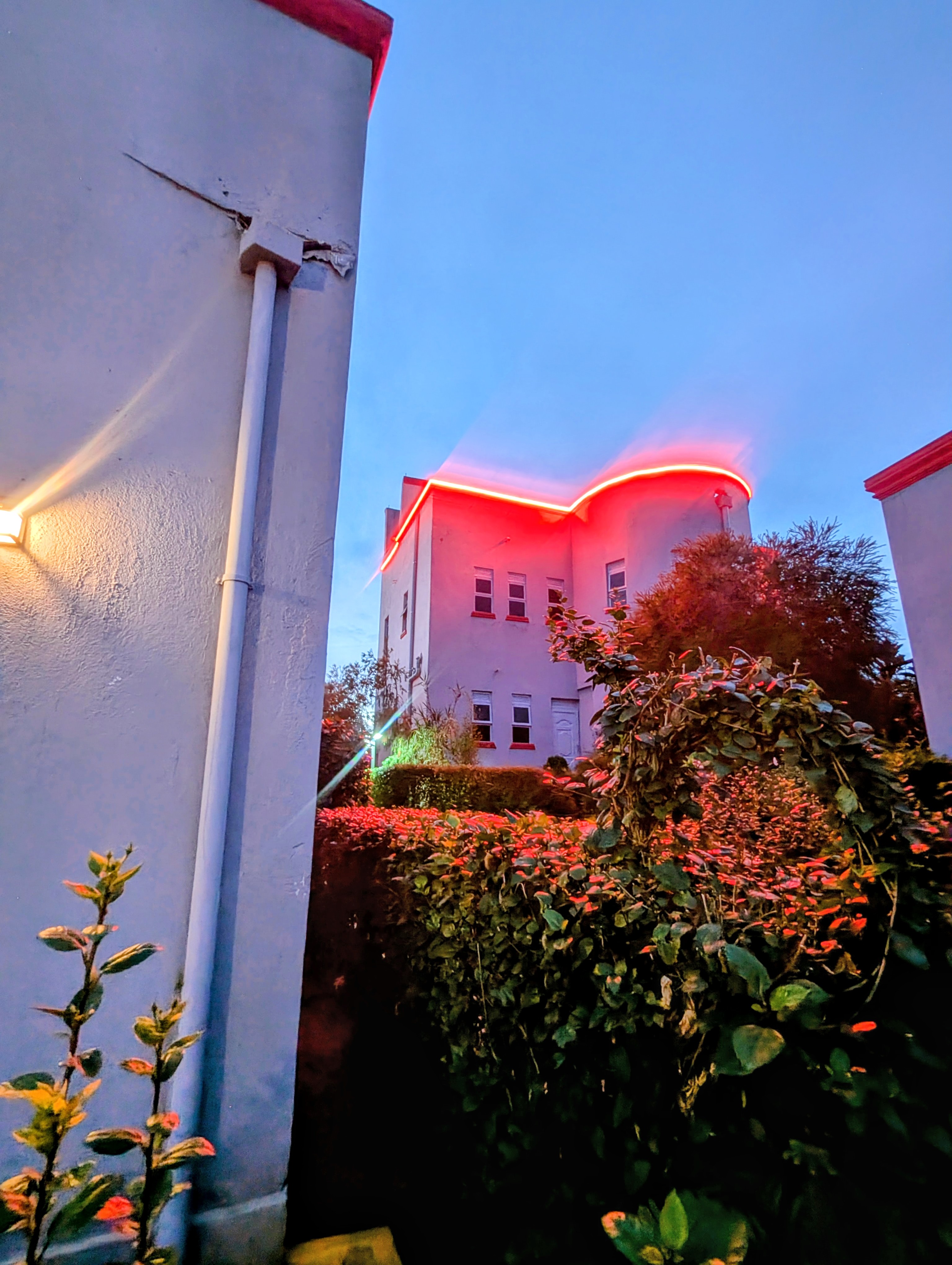 Akengyeya Country Hotel exterior view at night with garden lighting