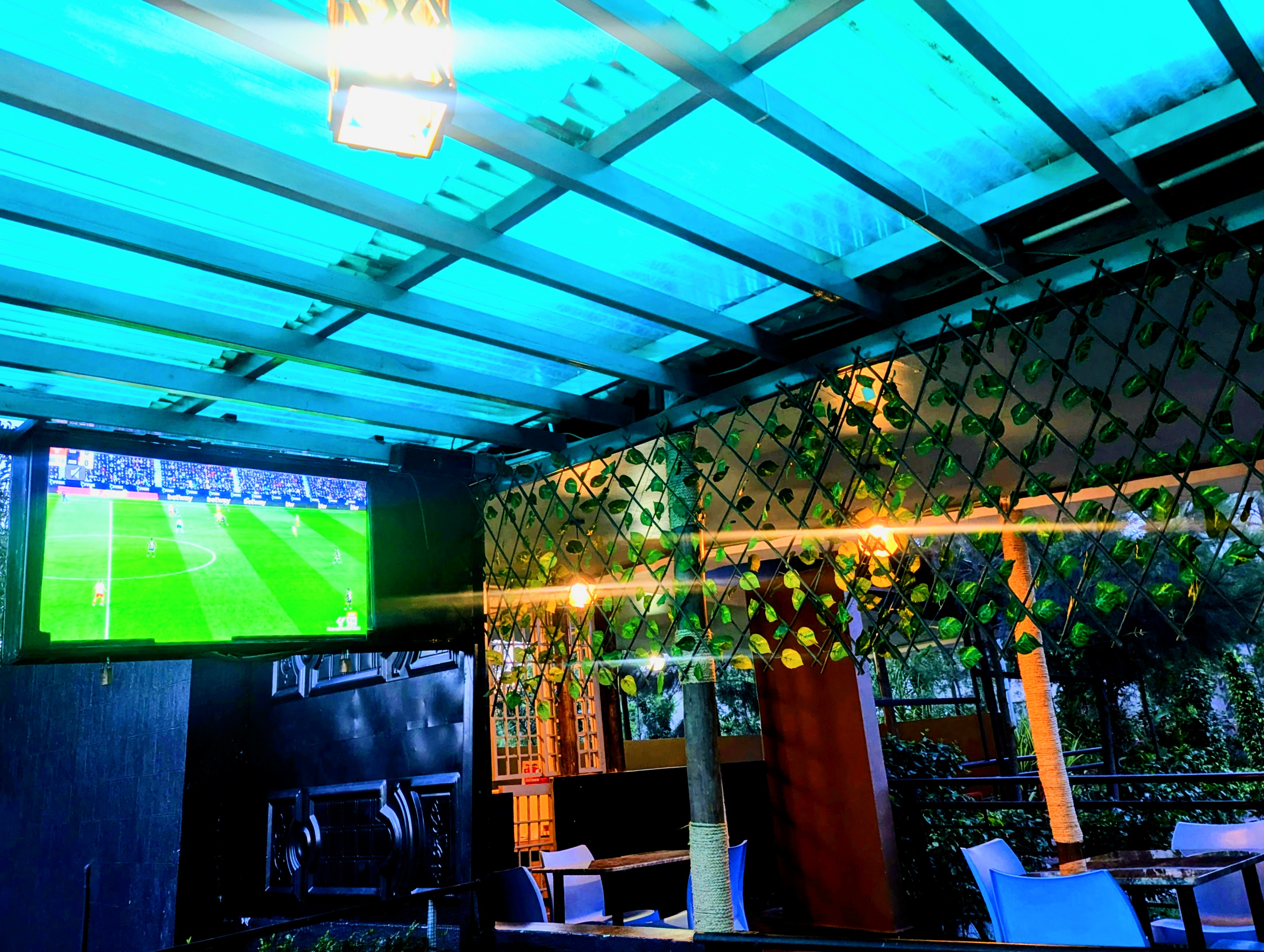 Akengyeya Country Hotel bar at night with vibrant atmosphere and lighting